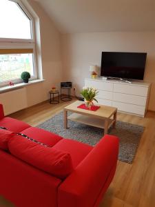 Televízia a/alebo spoločenská miestnosť v ubytovaní Apartment Karpacz