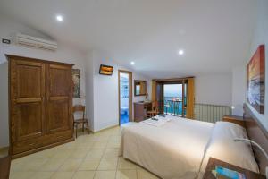 Postel nebo postele na pokoji v ubytování B&B Il Nespolo