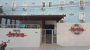 a building with a sign that reads hotel enchantment at Hotel Americas in Fortaleza