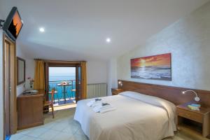 Postel nebo postele na pokoji v ubytování B&B Il Nespolo