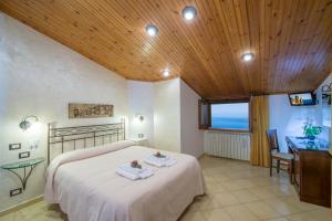 Postel nebo postele na pokoji v ubytování B&B Il Nespolo