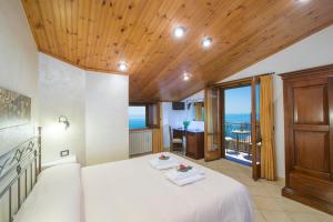 Postel nebo postele na pokoji v ubytování B&B Il Nespolo