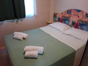 Posteľ alebo postele v izbe v ubytovaní Villaggio Mithos