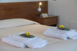 Postel nebo postele na pokoji v ubytování B&B Il Nespolo