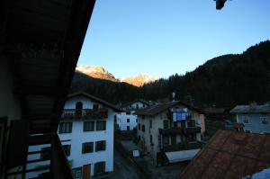 a view of a town with mountains in the background at Casa Katia in Canale dʼAgordo +2 photos