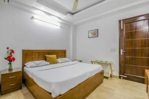 New India home stay tesisinde bir odada yatak veya yataklar