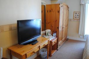 TV a/nebo společenská místnost v ubytování Craig-Ard Hotel