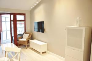 En tv och/eller ett underhållningssystem på Apartament Sea & Relax