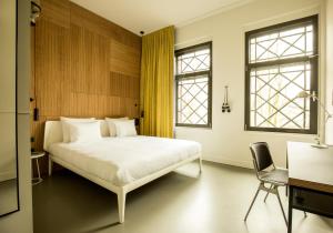 En eller flere senge i et værelse på Conscious Hotel Westerpark