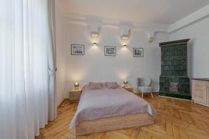 Posteľ alebo postele v izbe v ubytovaní Krakow For You Budget Apartments