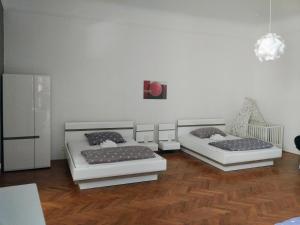 Postel nebo postele na pokoji v ubytování Apartments Týnská 7