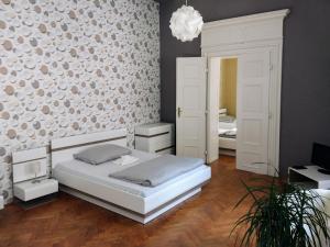 Postel nebo postele na pokoji v ubytování Apartments Týnská 7