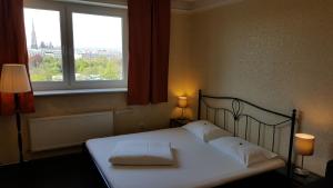 Postel nebo postele na pokoji v ubytování Hotel Goldene Spinne
