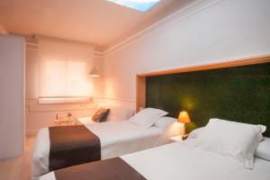 Posteľ alebo postele v izbe v ubytovaní Hotel Ribes Roges