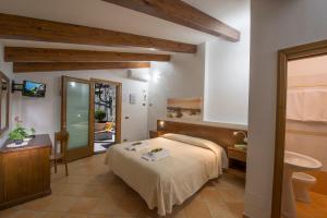 Postel nebo postele na pokoji v ubytování B&B Il Nespolo