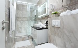Kúpeľňa v ubytovaní Well Of Life Luxury Rooms + 22 fotografií