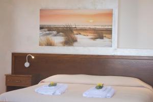 Postel nebo postele na pokoji v ubytování B&B Il Nespolo