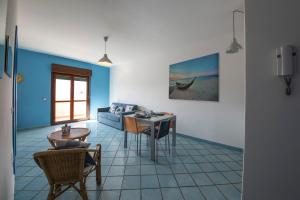 a living room with a couch and a table at Residence Flora in Paestum