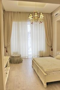 Giường trong phòng chung tại Hotel Menshikov