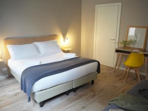 Postel nebo postele na pokoji v ubytování Hotel Centro