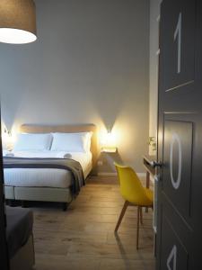 Katil atau katil-katil dalam bilik di Hotel Centro