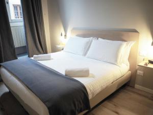 Postel nebo postele na pokoji v ubytování Hotel Centro
