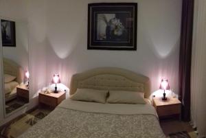 Ein Bett oder Betten in einem Zimmer der Unterkunft Aleksandra