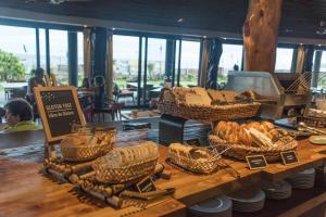 a counter with baskets of bread on a table at Nayara Hangaroa in Hanga Roa
