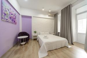 Postel nebo postele na pokoji v ubytování Basseynaya Apart Hotel