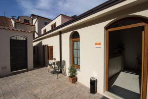 a house with a courtyard with a door and a patio at Villa Divani in Mostar