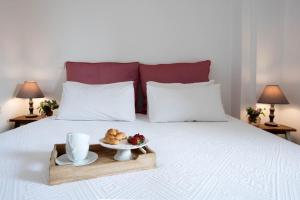Ένα ή περισσότερα κρεβάτια σε δωμάτιο στο Lavender Cottage.