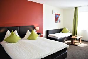 Postel nebo postele na pokoji v ubytování Hotel AM Schloss