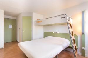 Postel nebo postele na pokoji v ubytování ibis budget Quimper