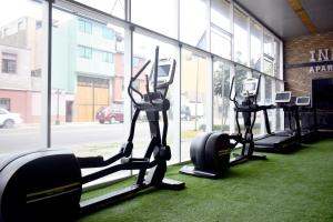 a row of tread machines in a gym with a window at Inkari Apart Hotel in Lima