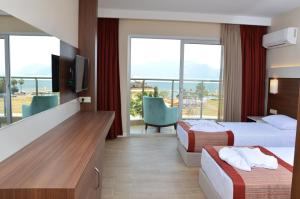 Postel nebo postele na pokoji v ubytování Sunway Club Otel