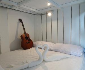 Postel nebo postele na pokoji v ubytování What's Up Chiang Mai