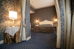 Кровать или кровати в номере Locanda Ca' del Brocchi