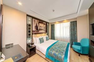 Postel nebo postele na pokoji v ubytování Mukarnas Taksim Hotel + 37 fotografií