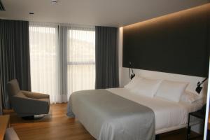 Postel nebo postele na pokoji v ubytování Hotel U Viveiro