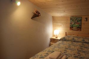 Albergo Diffuso Fallerにあるベッド
