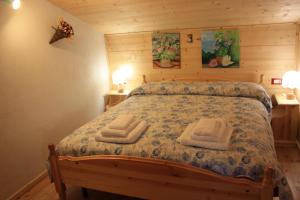 Albergo Diffuso Fallerにあるベッド