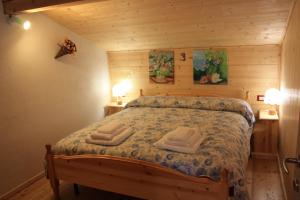 Albergo Diffuso Fallerにあるベッド