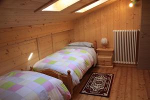 Albergo Diffuso Fallerにあるベッド