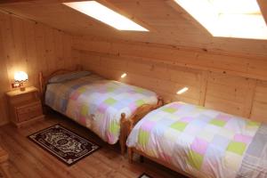 Albergo Diffuso Fallerにあるベッド