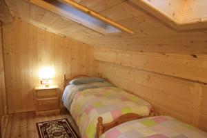 Albergo Diffuso Fallerにあるベッド