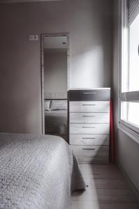 Łóżko lub łóżka w pokoju w obiekcie Piso centro