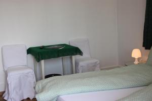 Postelja oz. postelje v sobi nastanitve B&B Stirnimann