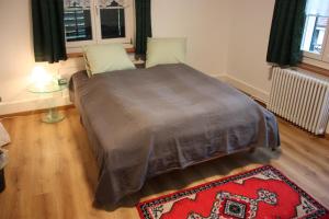 Postelja oz. postelje v sobi nastanitve B&B Stirnimann
