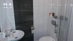 Kúpeľňa v ubytovaní Cracow Central Aparthotel
