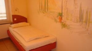 En eller flere senge i et værelse på StadtHotel Passau + 21 billeder